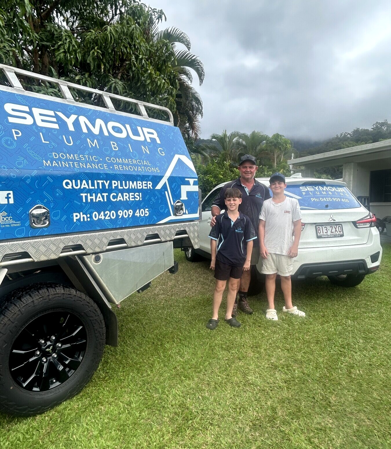 Ryan Seymour and his family in front of the Seymour Plumbing work vehicle